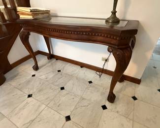 Carved wooden console table with marble inlay top
