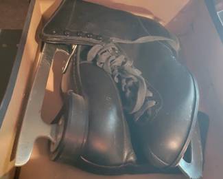 Multiple sets of vintage ice and roller skates