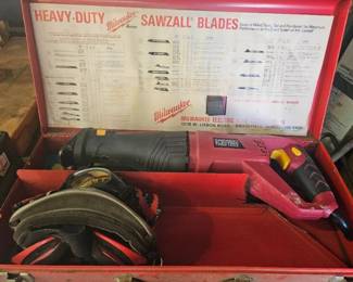 Heavy‑duty reciprocating saw (Sawzall) set in a red carrying case with blades and accessories.