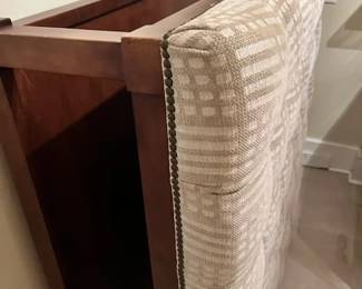 Ottoman has lower shelf for books, etc.l