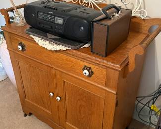 This is from our first walk through of the home. This is a lovely vintage, solid oak commode cupboard.