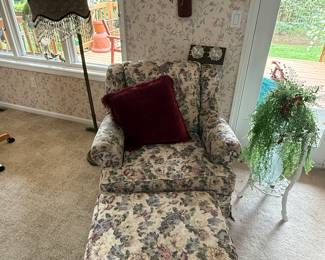 This is from our first walk through of the home. This is a beautiful upholstered floral chair and ottoman. In superb condition and very comfortable.