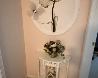 This is from our first walk through of the home. Beautiful little hallway table. The home also has lots of floral artwork.