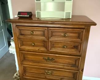 This is from our first walk through of the home. This is the dresser from a four-piece Thomasville bedroom set. Sitting on top of it is a lovely Bose CD stereo system.