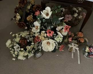 Lots of silk flower arrangements