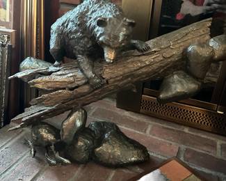 Large bronze bear on log figure