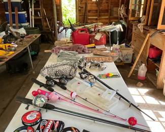 Garage View Fishing Equipment, Gas Cans, Old License Plates, Tools