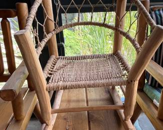 A Childs Rustic Wood & Woven Rocker (Location Inside Patio)