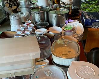 Assorted Pots & Pans, Cookware, Servingware, Dishes & Tupperware & More Some on the Large Picnic Table Location Enclosed Patio & Some in the Kitchen