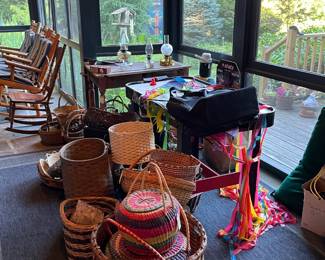 Adirondack Style Rockers & Chairs in the Background & Hundreds of Baskets of All Sizes from All over the World & Kites sitting on an Air Hockey Table Assorted Pots & Pans, Cookware, Servingware, Dishes & Tupperware & More Location Enclosed Patio