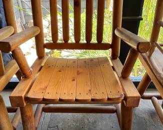 1 of an Assortment of Rustic Adirondack Chairs (Location Inside Patio)