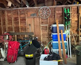 Bikes, Volleyball Net, Coolers, Bikes, Hiking Bac Pack, Extension Cords, Wheel on Wall, Gas Can, Exercise Bike Location Garage