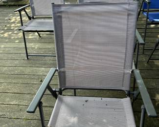 4 Grey Outside Folding Chairs ((Location Outside Patio)