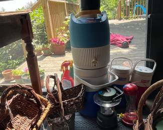 Vintage Coleman Camping Jugs amongst Baskets (Enclosed Patio)