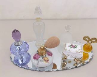 Lot of Vintage Perfume Bottles on a Small Dresser Mirror