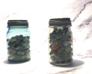 2 Ball Mason Jars With Metal Lids Containing Marbles 