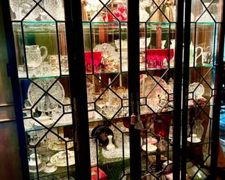 Large lighted beautiful china cabinet loaded full.