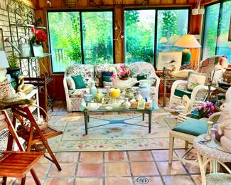 Sunroom with beautiful country patio furniture 