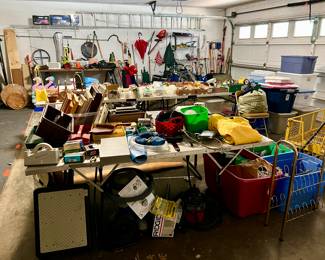 Garage with hand held tools, ladder, frames, etc.