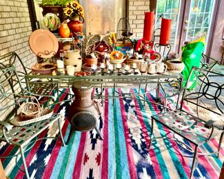 Back patio table full of Mexican pottery