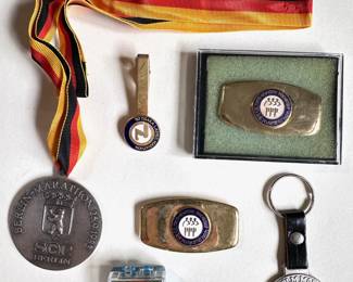 6 1980s International Marathon Medals, Pins, Clips & Keychains: Osaka, Stockholm, Berlin & More
Lot #: 134