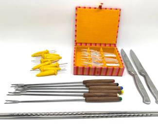 New In Box Cocktail Fork Set, Fondue Forks, Oneida Steak Knives, Corn Holders & Metal Chopsticks
Lot #: 110
