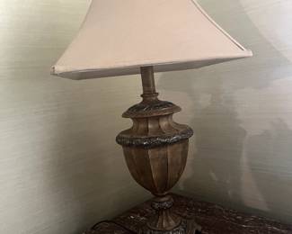 Antique lamp, marble top tables.