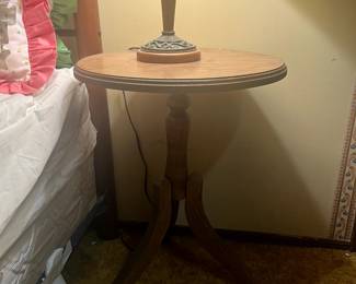 Pedestal table, vintage lamp. Mattress and boxspring, pillows.