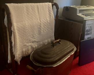 Copper basin, antique towel rack, quilt.