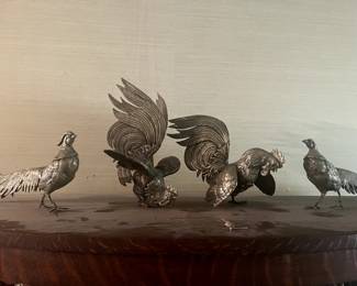 Antique collectible rooster sculptures, sold separately. 