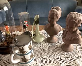 Artwork, ceramics, pottery, collectible items, vases, steins. 