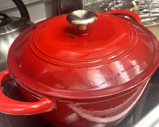 New red stock pot with lid.