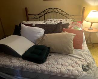 Queen bed frame, pillows, mattress and box spring, lamp, pedestal side table.
