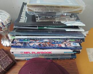 Sports magazines and photos, mostly Seahawks