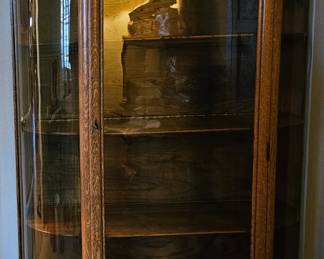 Antique curved glass display / curio cabinet.