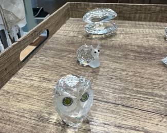 Owl, snail, oyster with pearl