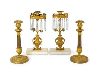 1235
Two pairs of gilt-bronze candlesticks
20th century
Comprising a pair of gilt-bronze girandole candlesticks with glass prism drops and white marble bases, and a pair of Louis Philippe gilt and patinated bronze candlesticks
4 pieces
Taller pair: 12.75" H x 6.25" W x 3.5" D; Shorter pair: 13" H x 8.5" W x 3.5" D
Estimate: $200 - $300