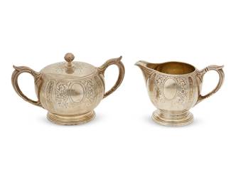 1015
A Gorham sterling silver creamer and sugar set
1922
Each marked for Gorham and for sterling with date mark; each numbered: A12403/1
Comprising a covered sugar and a cream jug, each with chased foliate motifs
2 pieces
Creamer: 3.75" H x 5.5" W x 3.5" D; Sugar: 4.25" H x 7.25" W x 4.5" D
21.6 oz. troy approximately
Estimate: $400 - $600