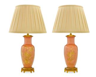 1247
A pair of gilt porcelain lamps
Marbro Lamp Company, mid-20th century
Underside of foot impressed in relief: MARBRO
The gilt-decorated matte salmon-glazed bodies each mounted as a two-light table lamp, with gilt-metal mounts, surmounted by a pleated fabric shade, electrified
2 pieces
Each lamp: 34.5" H x 6.75" W x 6.75" D; Each shade: 13.25" H x 20" Dia.
Estimate: $400 - $600