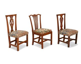1066
Three George III Provincial carved wood side chairs
18th/19th century
Each of various woods and a variation of openwork splat, two with upholstered seats
and one with an upholstered slip seat, each raised on square legs joined by stretchers
3 pieces
Tallest: 37.75" H x 21" W x 18" D; Shortest: 37.25" H x 20.25" W x 19" D
Estimate: $100 - $200