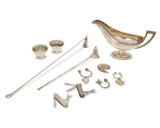 1019
A group of Tiffany & Co. sterling silver items
19th/20th century
Each marked for sterling; most marked for Tiffany & Co, two marked for Asprey; sauce boat numbered: 686 / 8839
Comprising two Tiffany & Co. sterling silver candle snuffers, one designed by Elsa Peretti (Larger: 17" L), a pair of miniature Revere bowls (1.5" H x 2.625" Dia.), a footed sauce boat with Greek key and beaded decoration (5.625" H x 9.75" W x 3.875" D), two Swiss Army knives, a key ring with heart tag, and a key ring with airplane and globe terminals, together with an Asprey comma-form letter opener and a key ring with cruciform tag
11 pieces
Total weighable sterling: 19.3 oz. troy approximately
Estimate: $400 - $600
