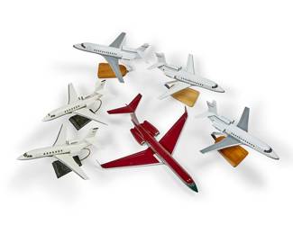 1114
A group of model planes
Late 20th/early 21st century
Most variously marked for maker; each with tail registration number
Five mounted on a stand
6 pieces
Largest (unmounted): 5" H x 23.5" W x 24" D; Smallest overall: 8.75" H x 16" W x 15.5" D
Estimate: $200 - $300