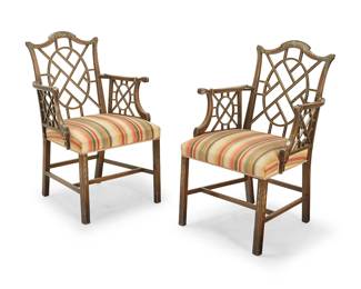 1099
A pair of Chinese Chippendale-style paint decorated wood armchairs
Mid-late 20th century
Each polychrome-painted chair with vinery decoration to the crest rail and arms, and bellflower decoration to the legs, with striped fabric upholstery
2 pieces
Each: 39" H x 26" W x 23" D
Estimate: $100 - $200