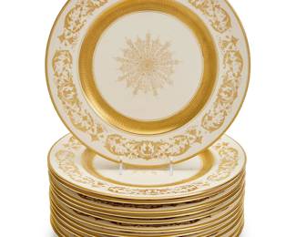 1161
A set of twelve Warrin porcelain dinner plates
20th century
Each stamped to underside: U.S.A. Warrin
Each with gilt filigree decorated rims and center starburst medallion on cream ground
12 pieces
Each: 10.5" Dia.
Estimate: $200 - $300