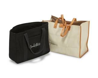 1172
Two designer tote bags
Late 20th/21st century
Each with label for maker
Comprising a Frederic Fekkai beige canvas tote with natural leather handles and trim, together with a Beverly Hills Hotel black canvas tote bag with exterior pocket
2 pieces
Larger: 12.5" H x 16.75" W x 8" D; Smaller: 11.5" H x 14.5" W x 5" D
Estimate: $100 - $150