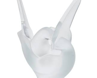 1308
A Lalique clear and frosted glass 'Sylvie' vase
Late 20th/early 21st century
Etched to underside: Lalique ® France [post-1978]
In the form of two conjoined doves
8.25" H x 7" W x 4" D
Estimate: $300 - $500