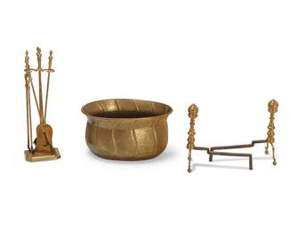1297
A group of brass and iron fireplace items
18th/19th century
Comprising a hammered brass oval firewood holder with fluted serpentine decoration, a pair of turned brass and iron andirons, and a contemporary set of brass and iron fireplace tools, including a shovel, a pair of tongs, a brush, and a poker
7 pieces
Firewood holder: 11.75" H x 22.25" W x 16.75" D; Each andiron: 16" H x 9" W x 16" D; Tool set: 27" H
Estimate: $300 - $500