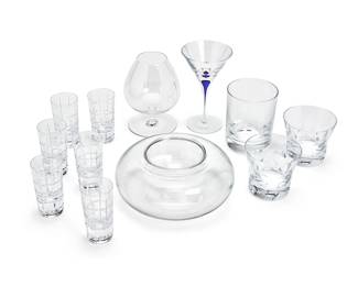 1289
A group of Contemporary glass items
Late 20th/early 21st century
Each with stenciled factory marks
Comprising a Baccarat 'Vesuve' bulbous caviar server with glass insert (3.5" H x 8" Dia.), a Baccarat cylindrical tumbler (4.75" H x 3.75" Dia.), a pair of Baccarat tumblers (3.25" H), a set of 6 Fabergé cut glass 'Metropolitan' shot glasses (3.75" H), a Baccarat stemmed brandy snifter (5.75" H x 4" Dia.), and an Orrefors Sweden martini glass with encased cobalt blue stem (6.375" H x 3.75" Dia.)
12 pieces
Estimate: $400 - $600