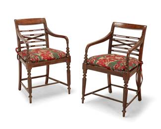 1241
A near pair of Edwardian walnut open armchairs
Early 20th century with later elements
Each with caned seat and green, red, and beige upholstered seat cushion with brass tacking, raised on fluted turned wood legs joined by bar stretchers
2 pieces
Each: 34" H x 23" W x 30" D
Estimate: $500 - $700