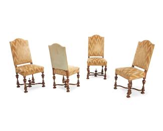 1136
A set of four Baroque-style dining chairs
20th century
Each carved wood chair on turned legs joined by a curvilinear X-stretcher, upholstered in a gold-toned fabric with suede seatback
4 pieces
Each: 40" H x 19" W x 18" D
Estimate: $300 - $500
